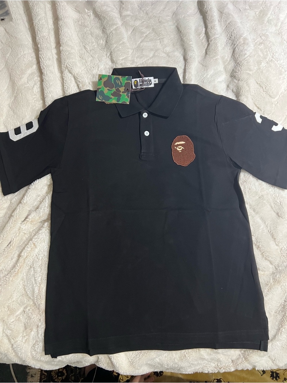 A Bathing Ape Black Polo Shirt with Ape Head Patch